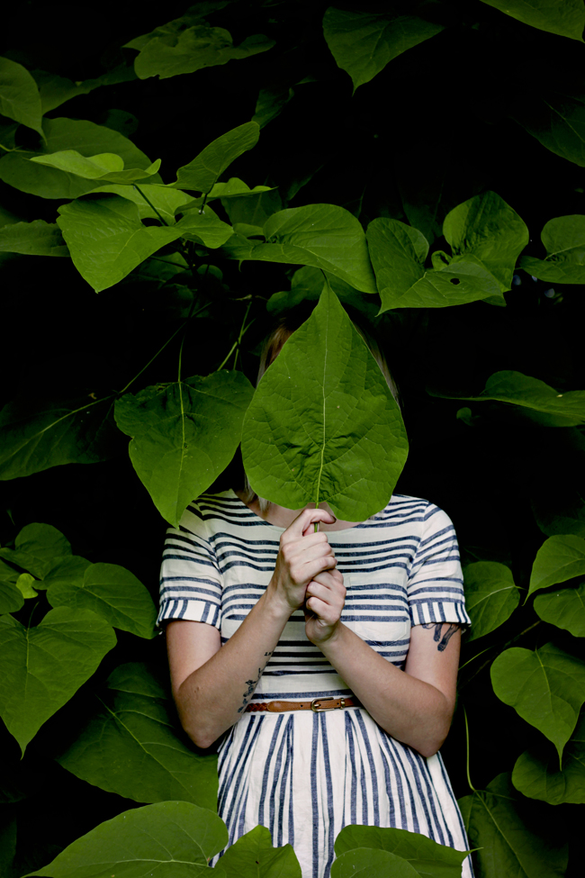 Alexis hiding behind leaf