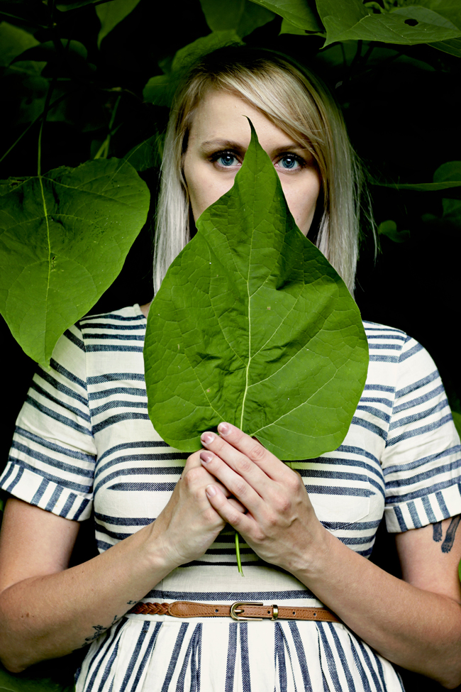 Alexis hiding behind leaf