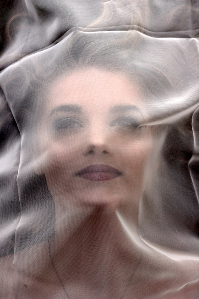 Breanna with face in plastic