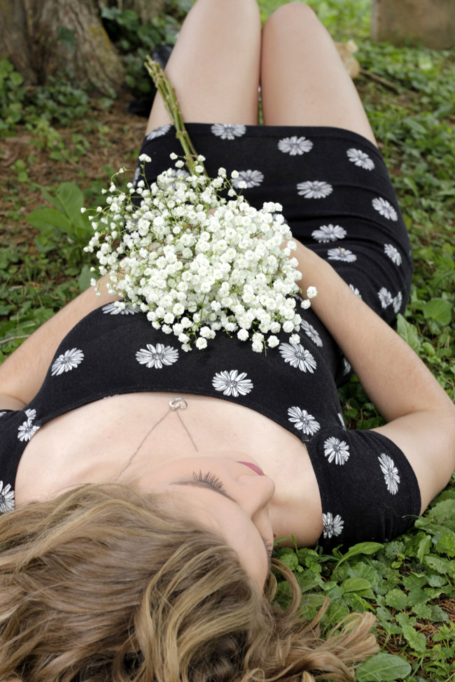 Breanna laying in grass