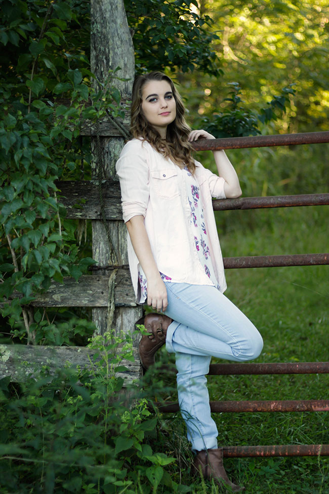 Girl posing on fence