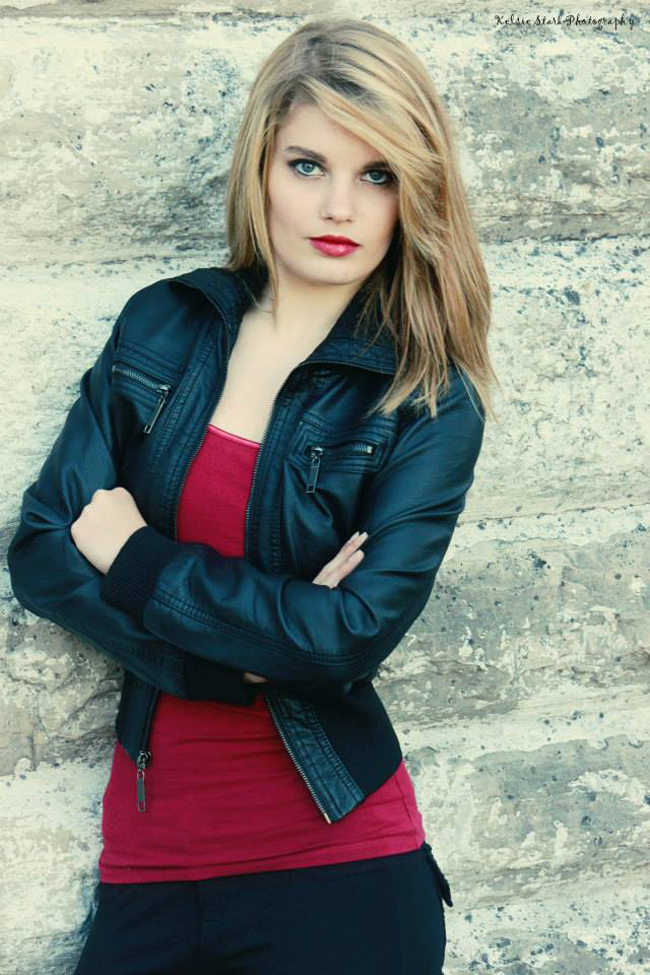 Girl leaning against wall
